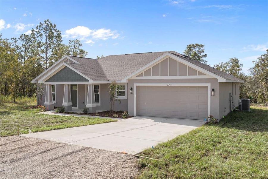 Front exterior of a new home in , Weeki Wachee, FL, highlighting curb appeal (Image 2). Front exterior of a new home in , Weeki Wachee, FL, highlighting curb appeal (Image 2).
