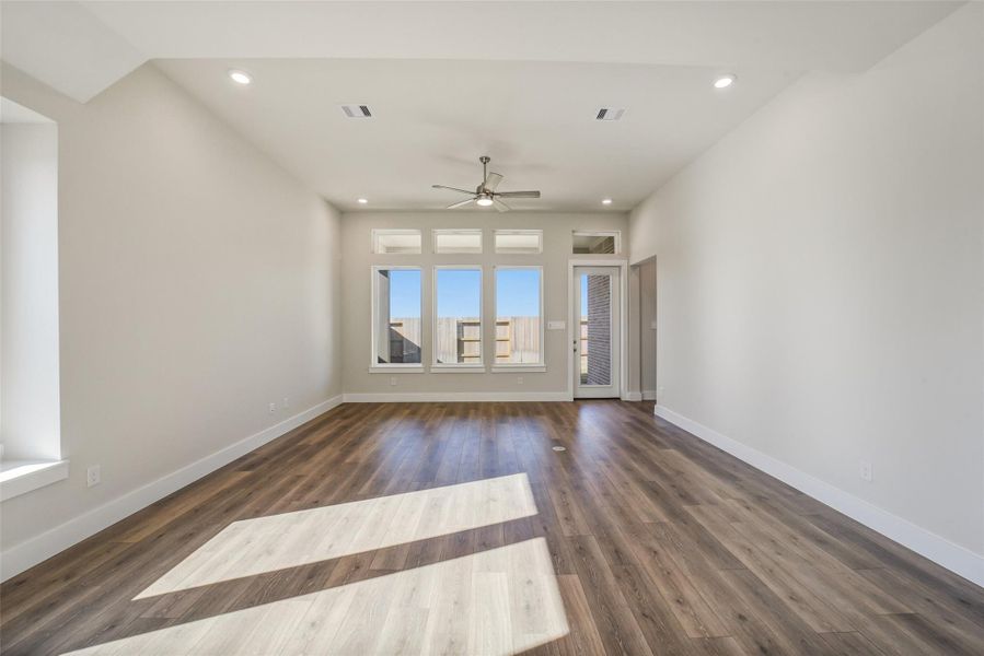 Spacious, unfurnished interior of a new home in Sunterra, Katy (Image 28).