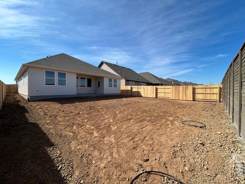 Exterior details and patio area of a home in Willow Springs, Buda (Image 16).