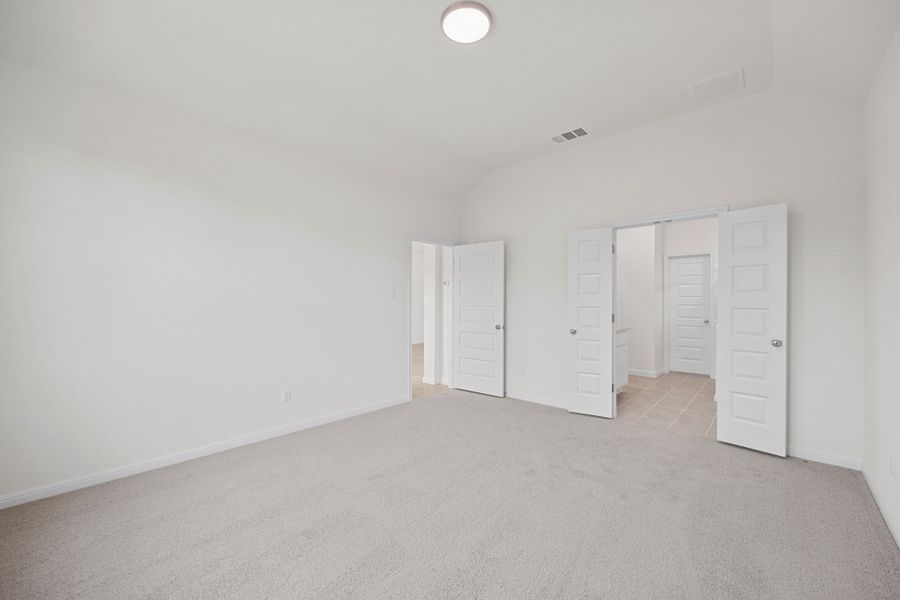 Primary Suite in the Elm home plan by Trophy Signature Homes – REPRESENTATIVE PHOTO