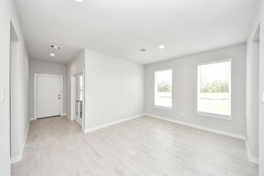 Craft enduring memories with loved ones around the table! This roomy dining area boasts stylish flooring, personalized paint, and is conveniently situated next to the family room and kitchen, fostering an open and inclusive ambiance. Craft enduring memories with loved ones around the table! This roomy dining area boasts stylish flooring, personalized paint, and is conveniently situated next to the family room and kitchen, fostering an open and inclusive ambiance.