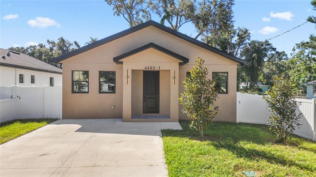 Front exterior of a new home in , Tampa, FL, highlighting curb appeal (Image 1). Front exterior of a new home in , Tampa, FL, highlighting curb appeal (Image 1).