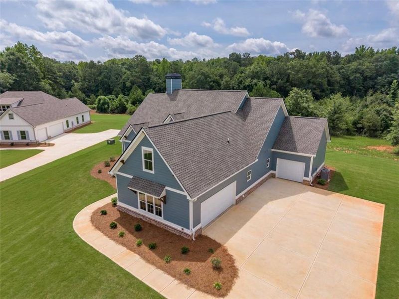 Front exterior of a new home in , Social Circle, GA, highlighting curb appeal (Image 27).