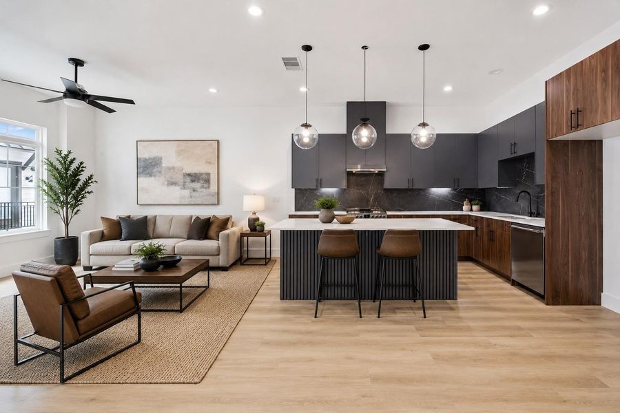 Showpiece kitchen with waterfall-style island, pendants, and wood accents