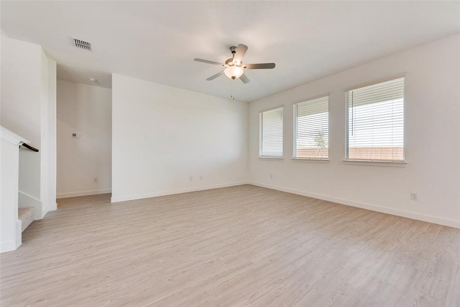 Spare room featuring light hardwood / wood-style flooring and ceiling fan