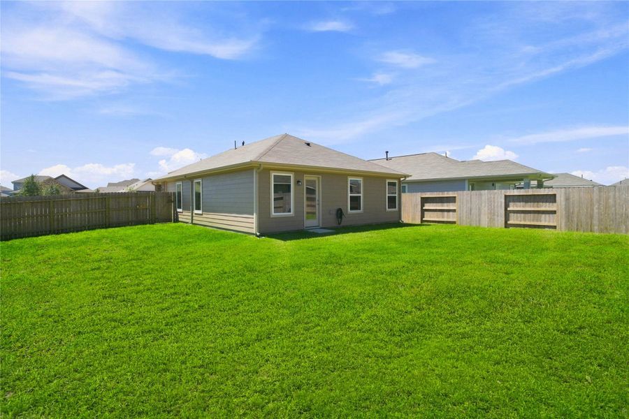 Situated on a premium corner lot, this expansive backyard space is a true blank slate, offering the ultimate footprint to design your dream pool oasis, outdoor kitchen, or custom patio layout.