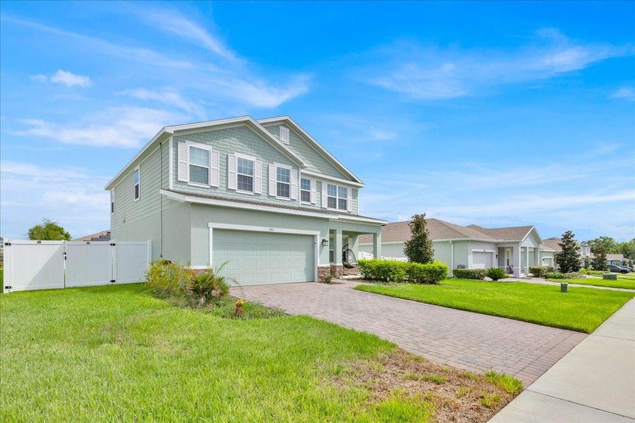 Front exterior of a new home in , Apopka, FL, highlighting curb appeal (Image 22).