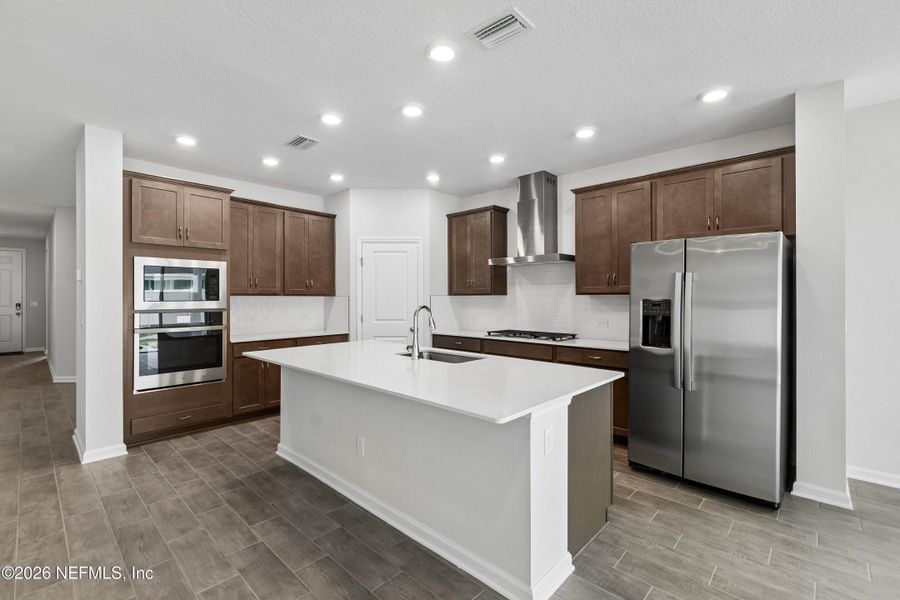 Furnished interior view inside a new home in Tributary 50', Yulee (Image 9).