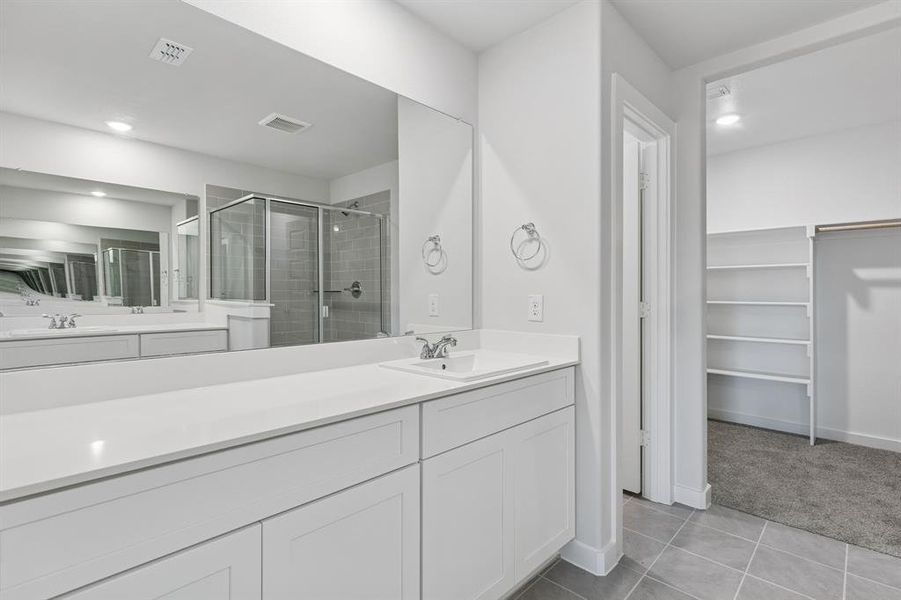 Primary Bathroom in the Harrison home plan by Trophy Signature Homes – REPRESENTATIVE PHOTO