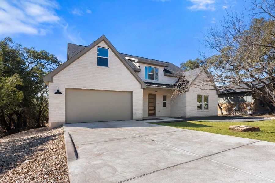 Front exterior of a new home in , Spicewood, TX, highlighting curb appeal (Image 14). Front exterior of a new home in , Spicewood, TX, highlighting curb appeal (Image 14).