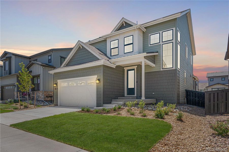 Front exterior of a new home in Harmony at Solstice, Littleton, CO, highlighting curb appeal (Image 1). Front exterior of a new home in Harmony at Solstice, Littleton, CO, highlighting curb appeal (Image 1).