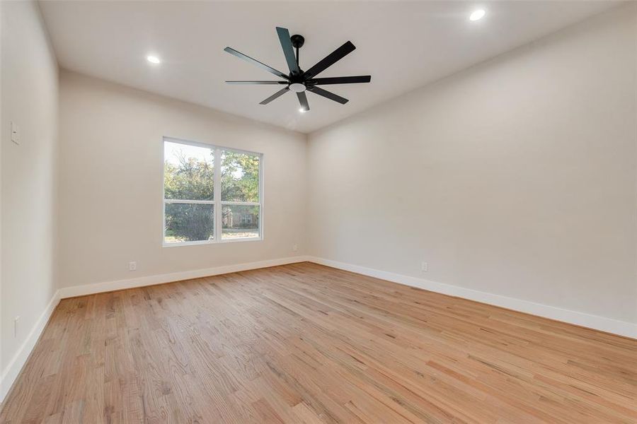 Spare room with light hardwood / wood-style floors and ceiling fan