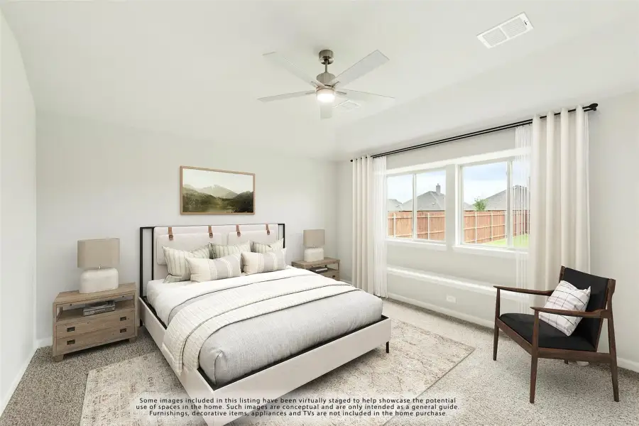 Bedroom with queen bed, ceiling fan, carpet flooring, and large window with white curtains