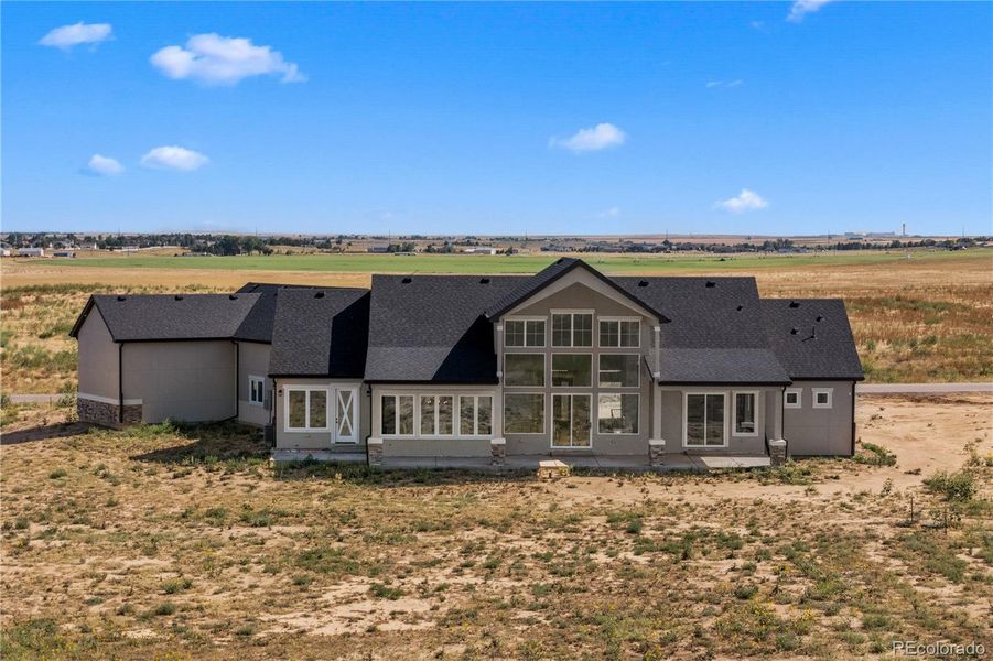 Front exterior of a new home in , Brighton, CO, highlighting curb appeal (Image 1).