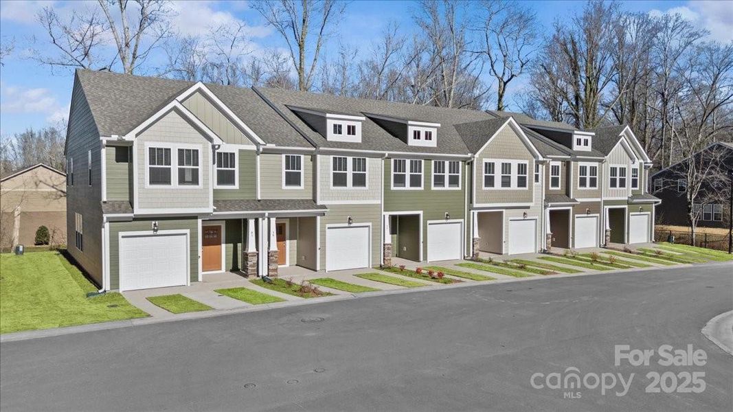 Front exterior of a new home in Clayton Crossing, Arden, NC, highlighting curb appeal (Image 2). Front exterior of a new home in Clayton Crossing, Arden, NC, highlighting curb appeal (Image 2).