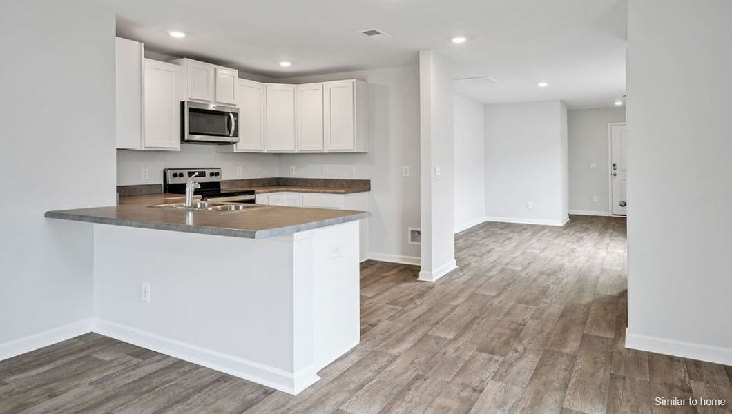 Representative furnished interior of a home built from the ALLEX by D.R. Horton in The Pines at Blake Farm, Wilmington (Image 16).