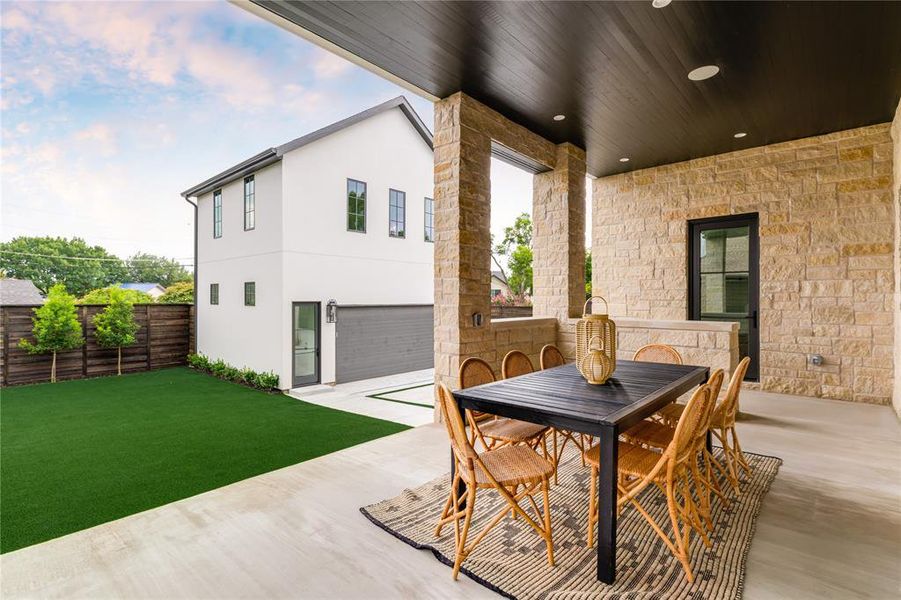Fenced backyard featuring outdoor dining area and a patio area