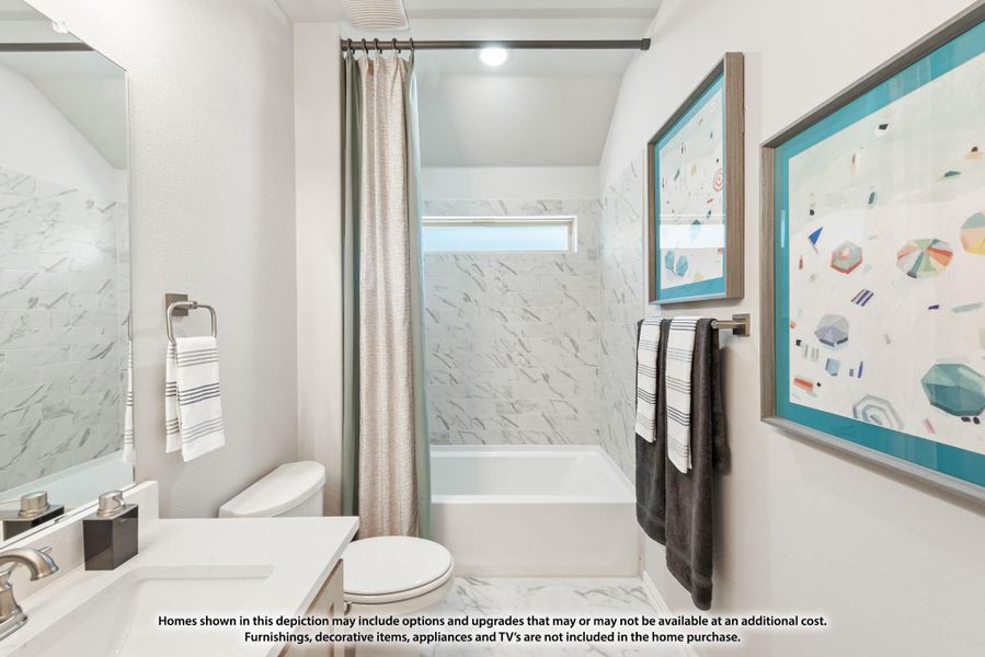 Bathroom with white vanity, tub-shower combo with marble tile surround, and curtain rod