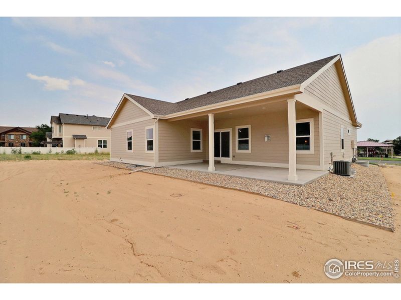 Front exterior of a new home in , Evans, CO, highlighting curb appeal (Image 18).