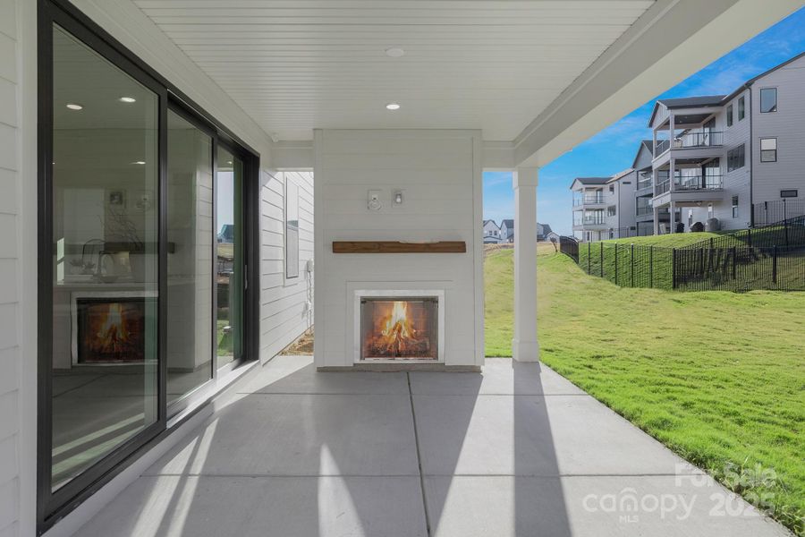 Covered patio w/ outdoor fireplace Covered patio w/ outdoor fireplace