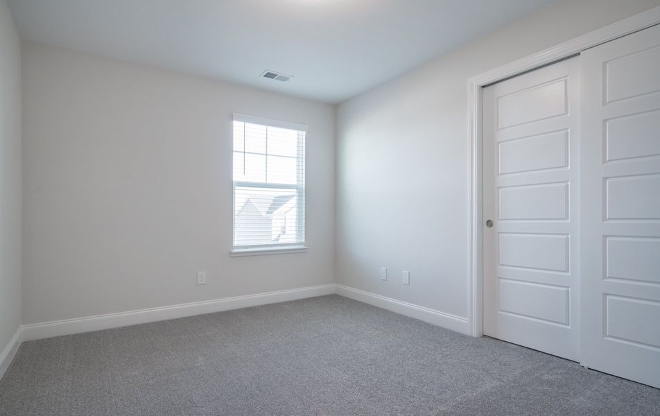 Representative unfurnished interior of a home built from the The Calle by Cothran Homes in Holly Ridge, Greenville (Image 29). Representative unfurnished interior of a home built from the The Calle by Cothran Homes in Holly Ridge, Greenville (Image 29).
