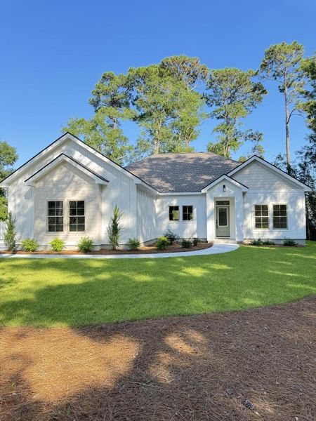 Front exterior of a new home in , Pawleys Island, SC, highlighting curb appeal (Image 1). Front exterior of a new home in , Pawleys Island, SC, highlighting curb appeal (Image 1).