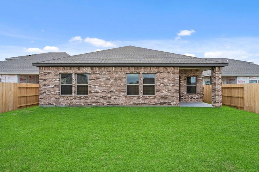 Exterior details and patio area of a home in Windrose Green, Angleton (Image 25).