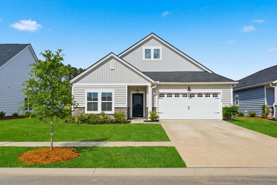 Front exterior of a new home in Horizons at Summers Corner | 55+, Summerville, SC, highlighting curb appeal (Image 30).