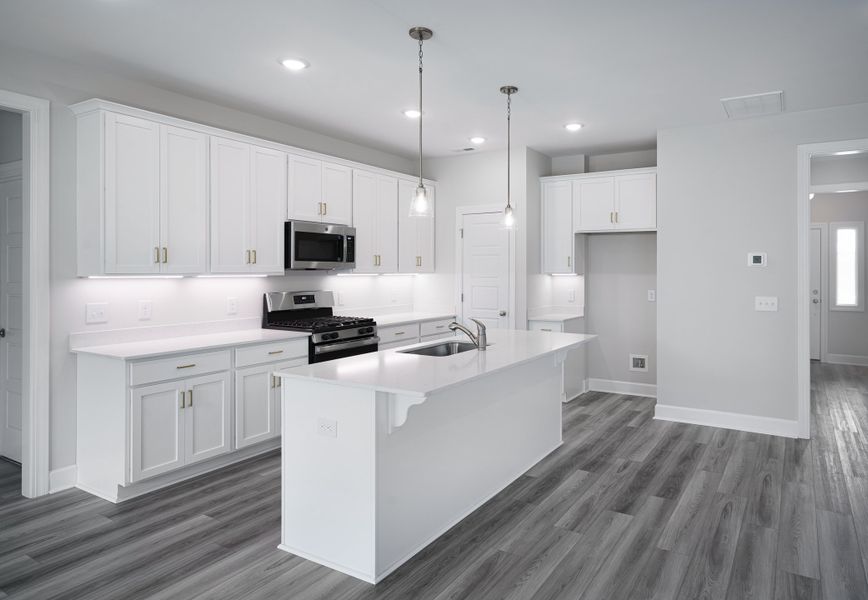 Representative furnished interior of a home built from the The McKee Manor by Cothran Homes in Holly Ridge, Greenville (Image 5). Representative furnished interior of a home built from the The McKee Manor by Cothran Homes in Holly Ridge, Greenville (Image 5).