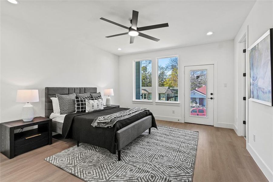 Bedroom featuring light hardwood / wood-style flooring and ceiling fan