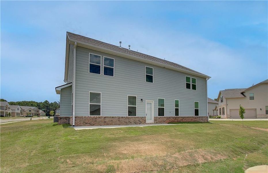Exterior details and patio area of a home in Berkeley Lakes, Locust Grove (Image 18).