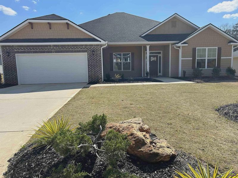 Front exterior of a new home in Barrington Place, Macon, GA, highlighting curb appeal (Image 1).