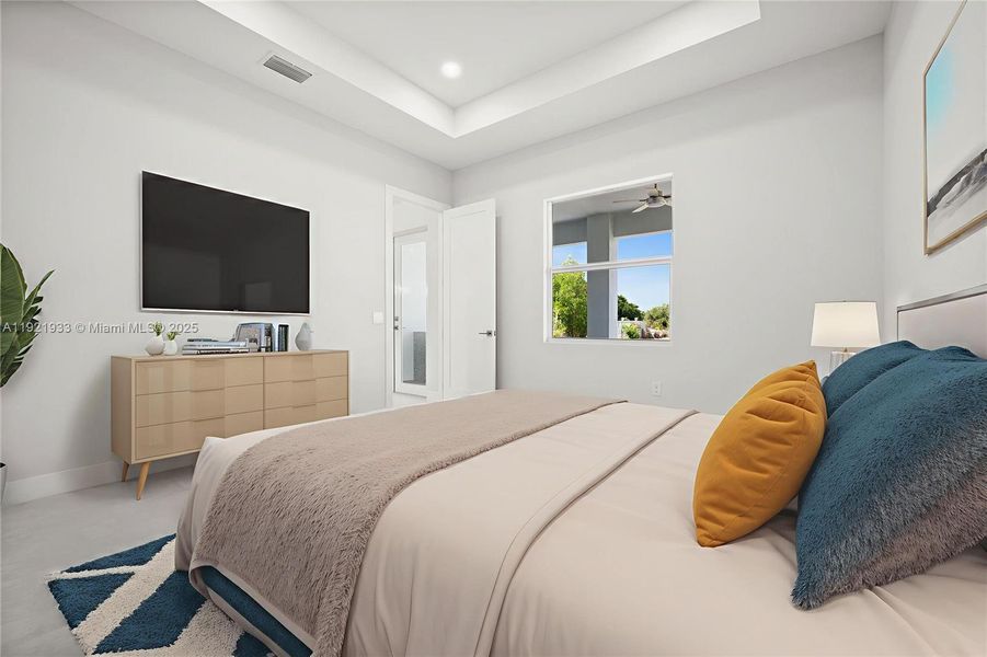 Bedroom featuring a raised ceiling andrecessed lighting Bedroom featuring a raised ceiling andrecessed lighting