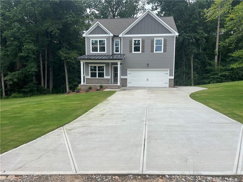 Front exterior of a new home in , Maysville, GA, highlighting curb appeal (Image 21). Front exterior of a new home in , Maysville, GA, highlighting curb appeal (Image 21).