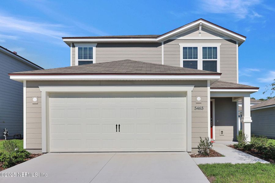 Front exterior of a new home in Wells Landing, Jacksonville, FL, highlighting curb appeal (Image 1). Front exterior of a new home in Wells Landing, Jacksonville, FL, highlighting curb appeal (Image 1).