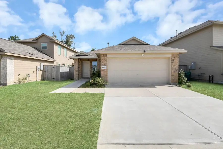Front exterior of a new home in Tavola, New Caney, TX, highlighting curb appeal (Image 2). Front exterior of a new home in Tavola, New Caney, TX, highlighting curb appeal (Image 2).