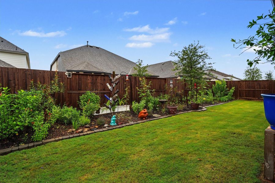 Lush landscaping in the back yard Lush landscaping in the back yard