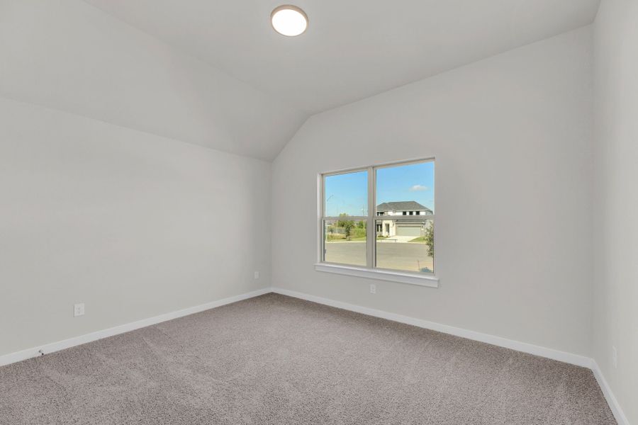 Bedroom in the Evelyn Pecos model home in Austin TX by Trophy Signature Homes