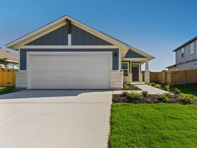 Front exterior of a new home in Riverbend at Double Eagle - Reserve Collection, Cedar Creek, TX, highlighting curb appeal (Image 1). Front exterior of a new home in Riverbend at Double Eagle - Reserve Collection, Cedar Creek, TX, highlighting curb appeal (Image 1).
