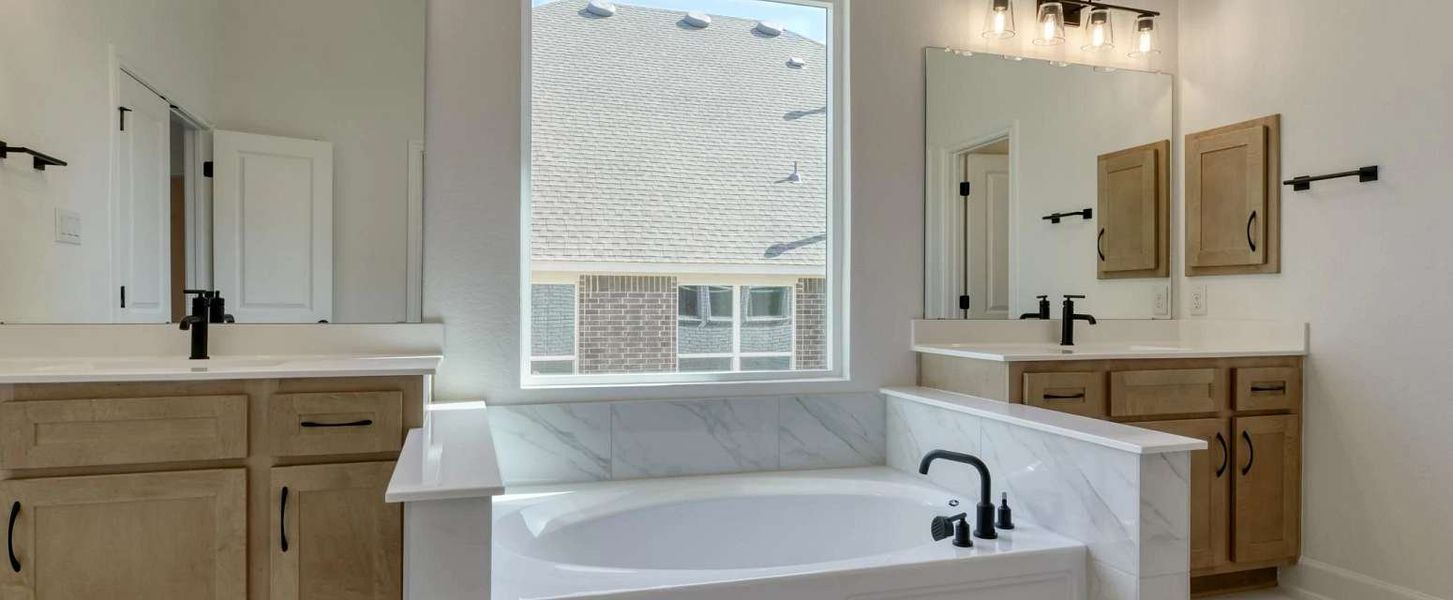 Representative furnished interior of a home built from the Alexander II by Ashton Woods in Sunday Creek at Kinder Ranch, San Antonio (Image 13).