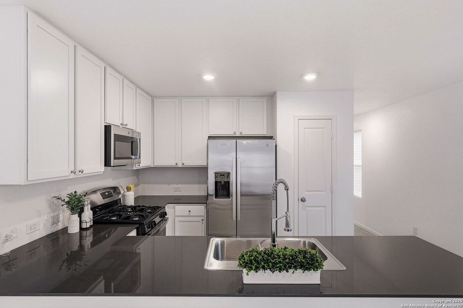 Furnished interior view inside a new home in Aston Park: Wellton Collection, San Antonio (Image 12).