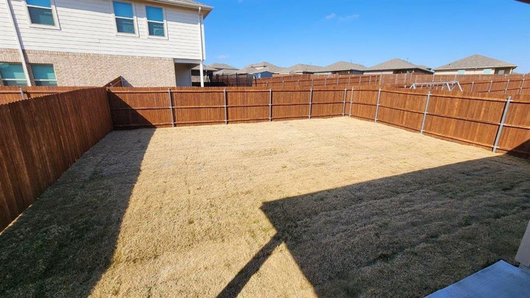 Exterior details and patio area of a home in Springhill South, Boyd (Image 19).