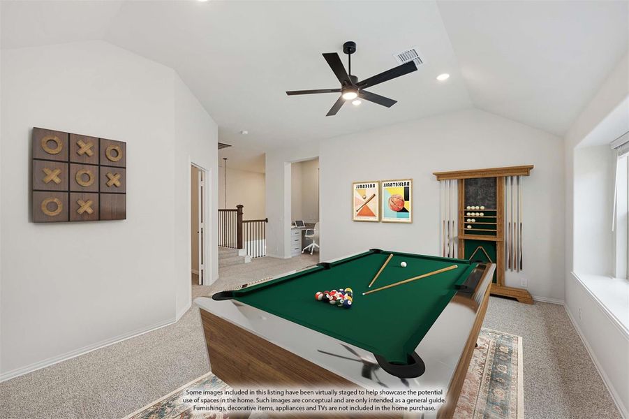 Game room with pool table, vaulted ceiling, ceiling fan, and cue rack on carpeted floor Game room with pool table, vaulted ceiling, ceiling fan, and cue rack on carpeted floor