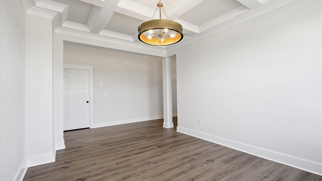 First-class dining area featuring a coffered ceiling and thoughtful architectural detail First-class dining area featuring a coffered ceiling and thoughtful architectural detail