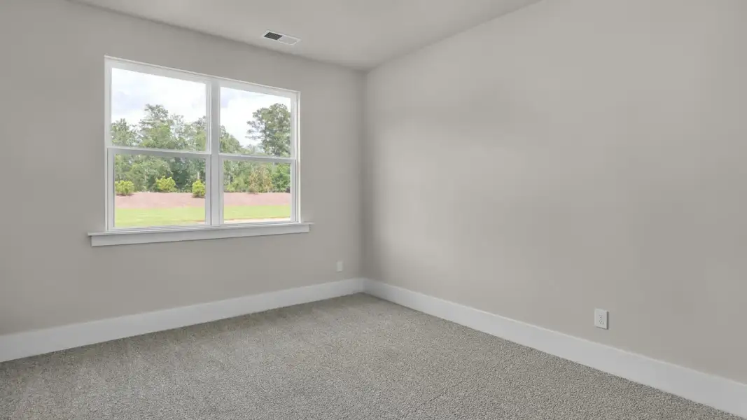 Representative unfurnished interior of a home built from the Forrester by D.R. Horton in The Highlands at Cedar Hill Landing, Navassa (Image 22).