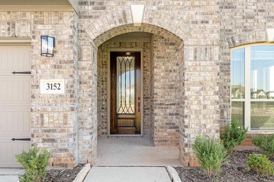 Front exterior of a new home in Abe's Landing, Granbury, TX, highlighting curb appeal (Image 25). Front exterior of a new home in Abe's Landing, Granbury, TX, highlighting curb appeal (Image 25).
