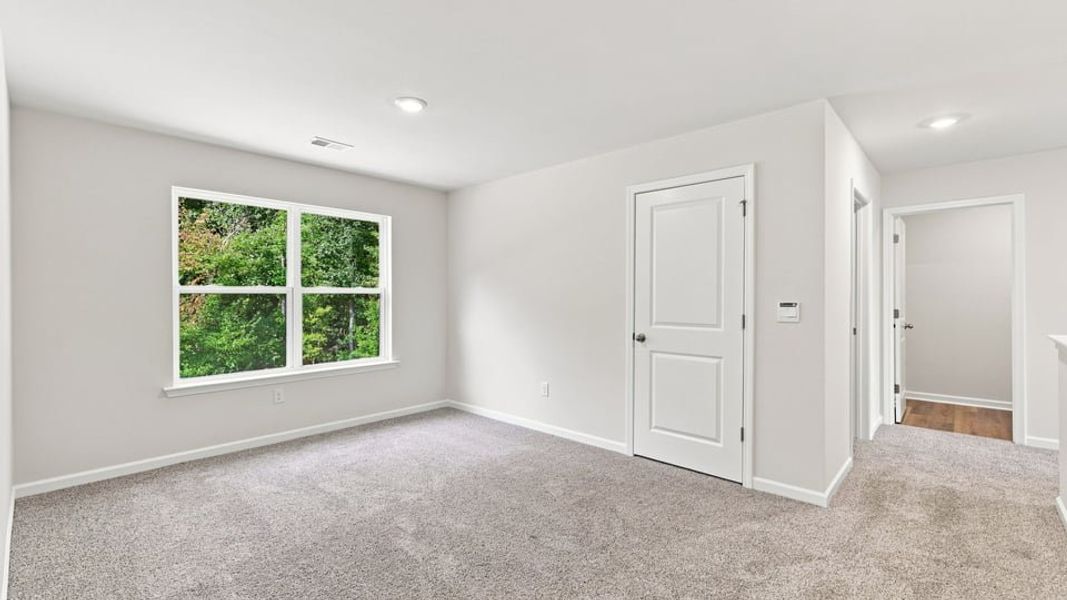 Spacious, unfurnished interior of a new home in Bentley Park, Greenwood (Image 24).