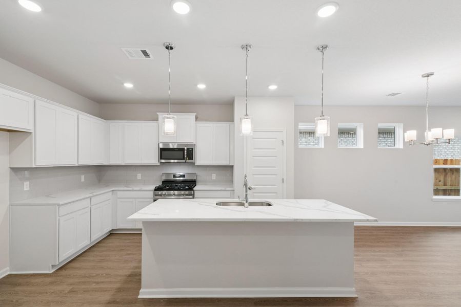 The Oakshire II- Kitchen with Island. Sample image for illustration; upgrades, options, and colors may vary. The Oakshire II- Kitchen with Island. Sample image for illustration; upgrades, options, and colors may vary.