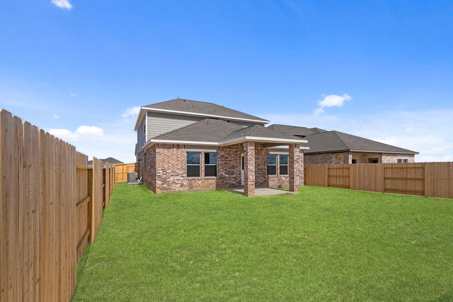 Exterior details and patio area of a home in Windrose Green, Angleton (Image 4).