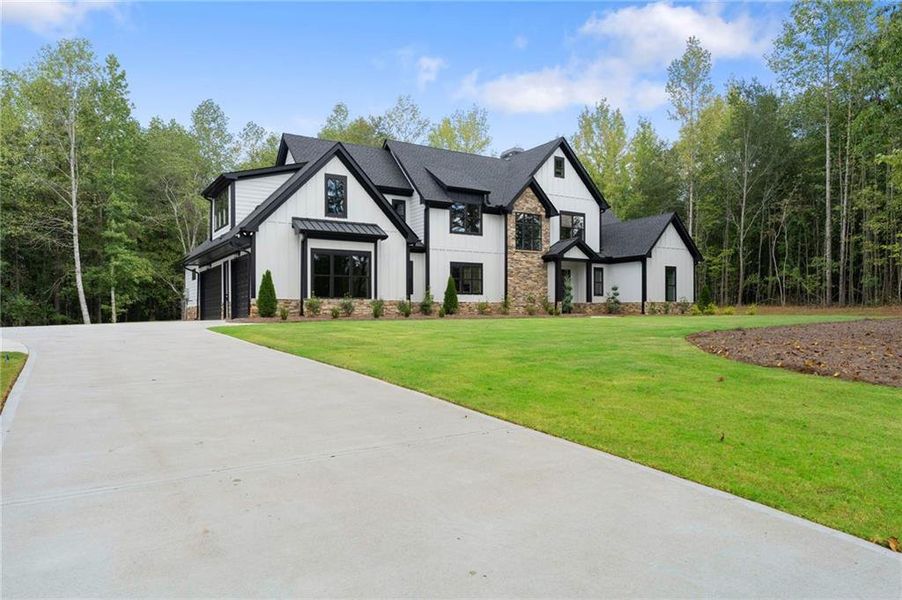 Front exterior of a new home in , Ball Ground, GA, highlighting curb appeal (Image 26).